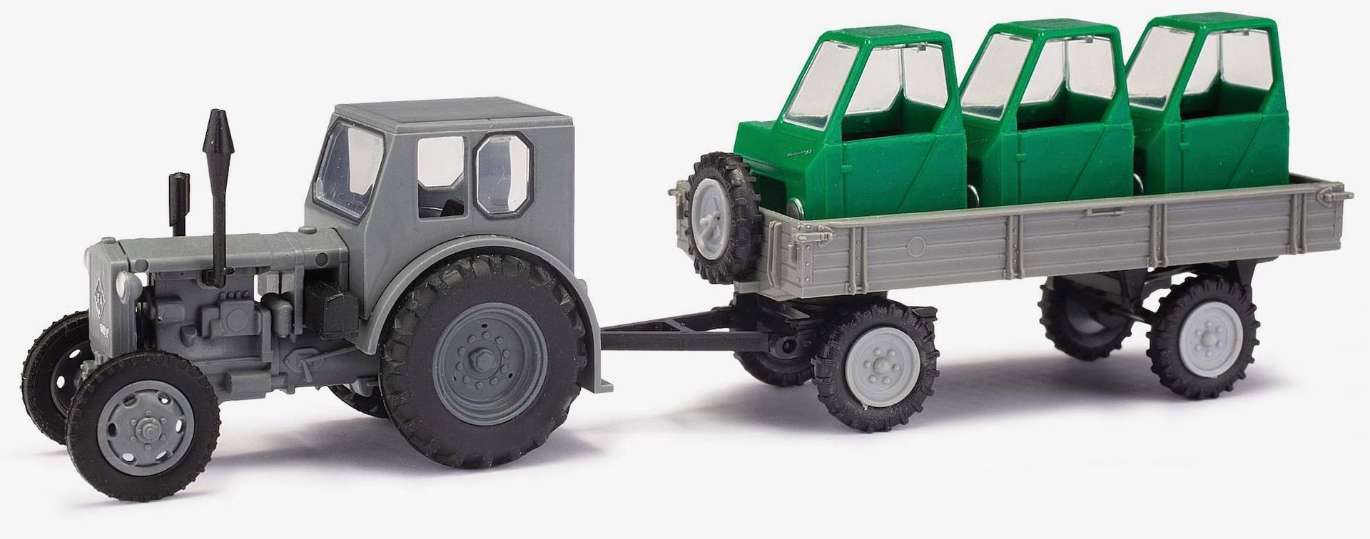 Melhose 210006430 - Traktor Pionier und Anhänger beladen mit Fahrerhäusern H0 1:87